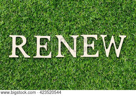 Wood Alphabet Letter In Word Renew On Green Grass Background