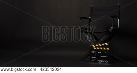 Black Director Chair And Clapper Board Or Movie Clapperboard On Black Background.use In Video Produc