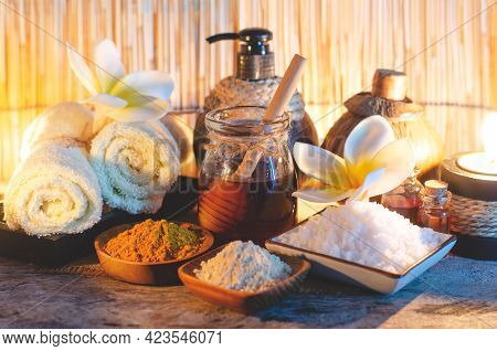 Fresh Organic Honey In Glass Bowl With Spa Salt, Turmeric Powder, Aroma Gel, Soft White Towl And Mas