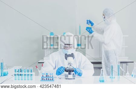 Two Asian Scientist Team Reserch Chemistry Science Tube Experiment Biotech Antibody Sample In Labora