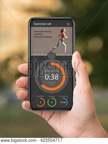 Woman Using Fitness Application On Mobile Phone, Traiding Outdoors