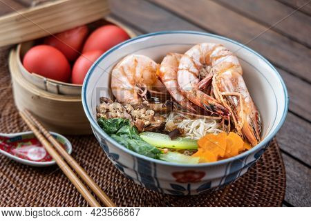 Close-up On Serving Of Birthday Longevity Noodles With Red Eggs, A Tradition Among Chinese During Bi