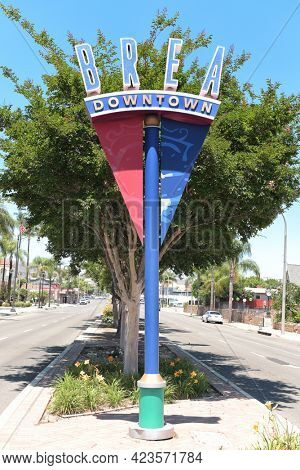 BREA, CALIFORNIA - 9 JUN 2021: Downtown Brea sign on Brea Boulevard across from City Hall Park.
