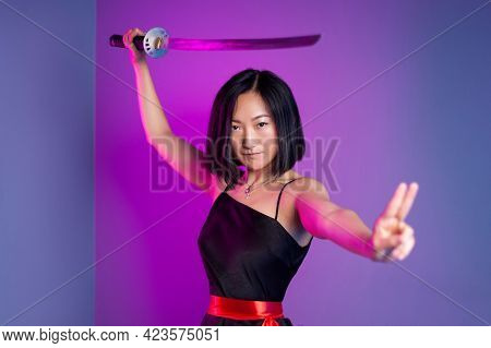 Slender Asian Woman In A Black Dress With A Katana In Her Hand Image Of A Samurai On A Neon Backgrou