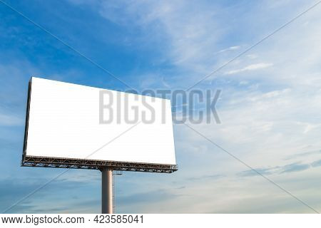 A Large White Billboard With A Blue Sky Can Be Used For Advertising.
