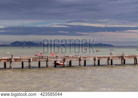A Side View Of The Harbor In The Sea With A Cloudy Sky As The Rain Approaches.
