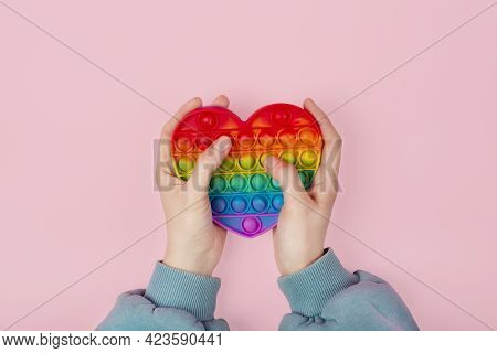 Hands Playing With Pop It Antistress Game Fidget. Pop Fidget Sensory Toy For Autism Special Needs St