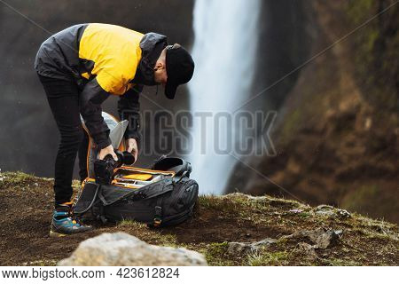Photographer at the Haifoss waterfall, Iceland