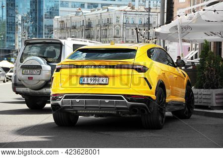 Kiev, Ukraine - May 22, 2021: Yellow Luxury Super Suv Lamborghini Urus In The City. Lamborghini Urus