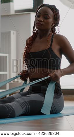 Athlete With Black Skin In Sportswear Exercising Body Muscle Using Fitness Elastic Enjoying Healthy 