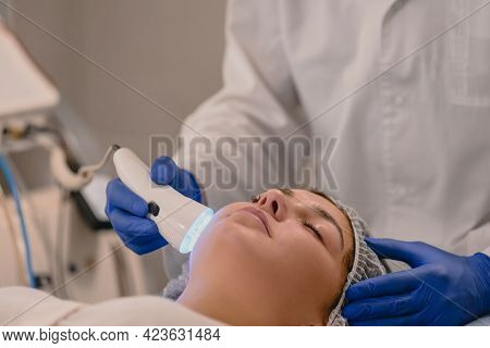 Woman Having Color Light Therapy To Stimulate Facial Skin Wellbeing