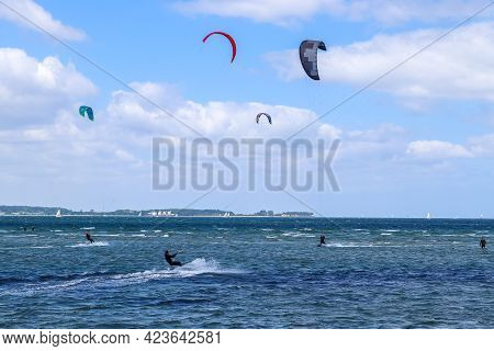 Lots Of Kite Surfing Activity At The Baltic Sea Beach Of Laboe In Germany On A Sunny Day