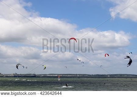 Lots Of Kite Surfing Activity At The Baltic Sea Beach Of Laboe In Germany On A Sunny Day