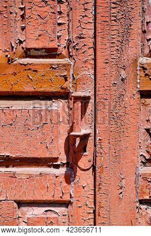 Texture Of The Old Door. Peeling Paint On Wooden Doors As A Deta