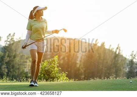 Golfer Sport Course Golf Ball Fairway. People Lifestyle Woman Relax After Swing Golf Ball On The Gre