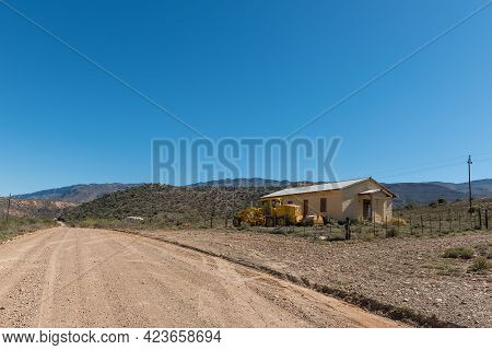 Sewefontein, South Africa - April 7, 2021: A Road Grader At A Building At Sewefontein On Road P294 I