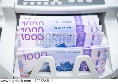 Norwegian Kroner Banknotes Inside Bank Branch Bill Counter. One Thousand Kroner Bills. Scandinavian 