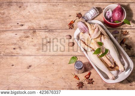 Raw Whole Chicken Carcass For Healthy Food Lifestyle With Traditional Chinese Spices In Ceramic Baki