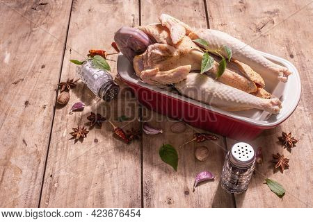 Raw Whole Chicken Carcass For Healthy Food Lifestyle With Traditional Chinese Spices In Ceramic Baki