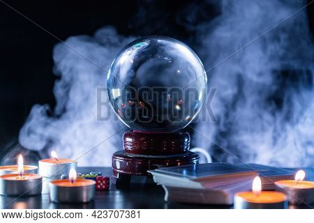 Magician Or Fortune Teller Is Predicting Future With Crystal Sphere.