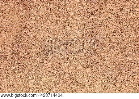 Texture Of A Plasterwork Painted In Beige Used As An Exterior Coating On A Building. An Abstract Bac