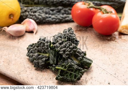 Cooking With Black Flat Leaves Of Cavolo Nero Tuscan Cabbage