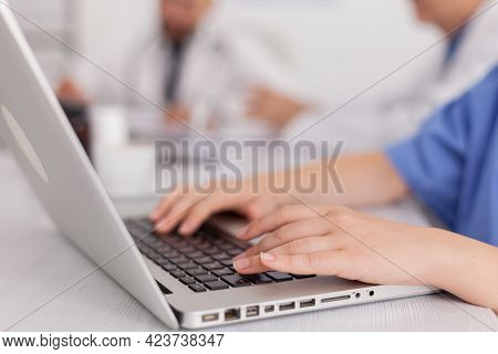 Close-up Of Therapist Asisstant Hands Working At Healthcare Treatment Typing Sickness Pill Medicatio