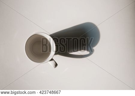 Coffee Cup With Long Shadow Top View. Morning Energy