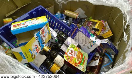 St. Petersburg, Russia - December 2019: Cardboard Box With Glass Bottles Of Alcohol, Wine, Canned Pr
