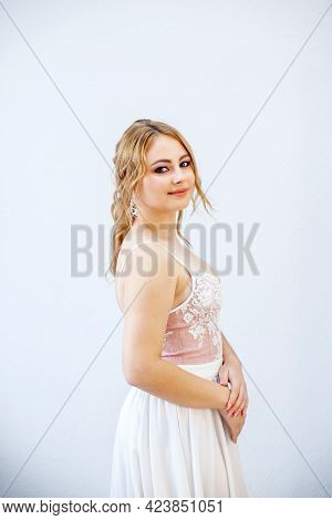 Blonde Girl In A Wedding Dress Bride In A White Dress. Makeup.