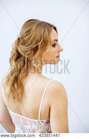 Blonde Girl In A Wedding Dress Bride In A White Dress. Makeup.