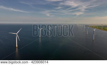 Wind Turbine From An Aerial View, Drone View At Windpark A Windmill Farm In The Lake Ijsselmeer The 
