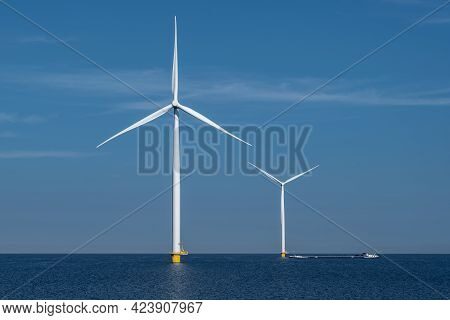 Wind Turbine From An Aerial View, Drone View At Windpark A Windmill Farm In The Lake Ijsselmeer The 