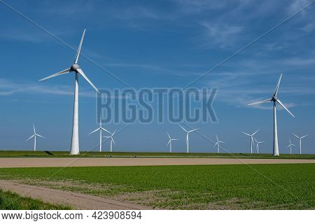 Wind Turbine From An Aerial View, Drone View At Windpark A Windmill Farm In The Lake Ijsselmeer The 