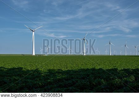 Wind Turbine From An Aerial View, Drone View At Windpark A Windmill Farm In The Lake Ijsselmeer The 