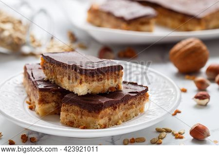 Homemade Vegan Cocoa Dates Chocolate Bars With Coconut, Hazelnuts, Walnuts And Sunflower Seeds On A 