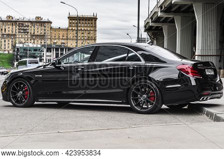 Moscow, Russia - June 2021: Black Mercedes Amg S63 Parked Along The Street. Rear Side View Of Premiu