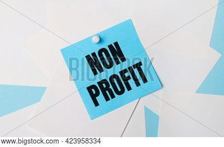 On A Light Blue Background, White Square Sheets Of Paper. A Light Blue Square Sticker With The Text 