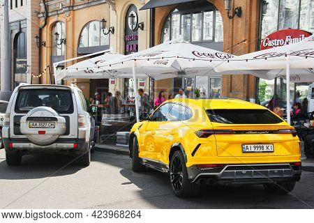Kiev, Ukraine - May 22, 2021: Yellow Luxury Super Suv Lamborghini Urus In The City. Lamborghini Urus