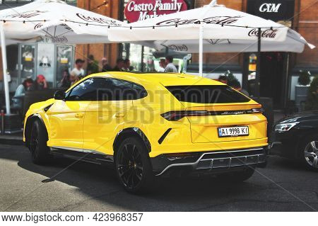 Kiev, Ukraine - May 22, 2021: Yellow Luxury Super Suv Lamborghini Urus In The City. Lamborghini Urus