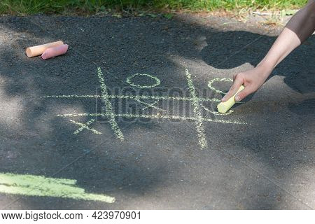 Tic-tac-toe Chalk Game On Asphalt, Drawing On The Sidewalk.