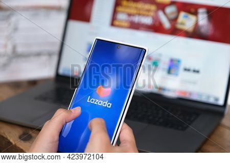 Chiang Mai, Thailand - 06 June 2021:woman Using Smartphone To Open Lazada App For Online Shopping On
