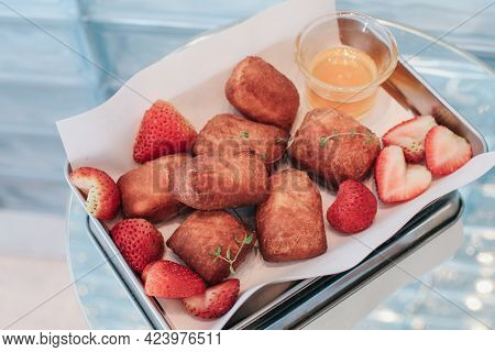 Traditional French Beignets Doughnuts With Strawberry And Powdered Sugar.
