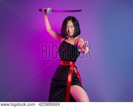 Slender Asian Woman In A Black Dress With A Katana In Her Hand Image Of A Samurai On A Neon Backgrou