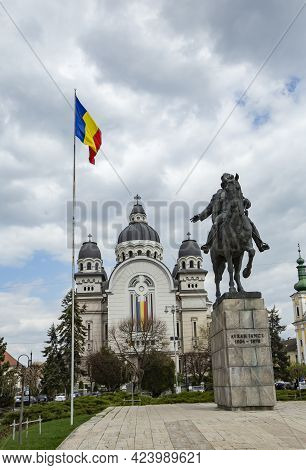 Targu Mures, Transylvania, Romania - April 23, 2021:  Avram Iancu Statue And Ascension Of The Lord, 