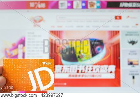 Zhongshan,china-june 17,2021:man Holding A Jd Shopping Card And Doing Onling Shopping On The Jingdon