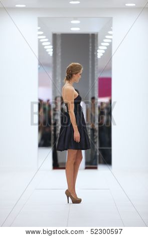 ZAGREB, CROATIA - OCTOBER 12: Fashion model in cocktail dress made by Lorien on 'Wedding Expo' show in the Westgate Shopping City in Zagreb, Croatia on October 12, 2013