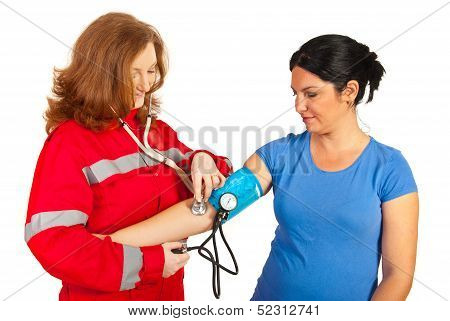 Paramedic Checking Blood Pressure