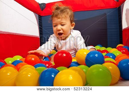Happy Baby Playing With Balls