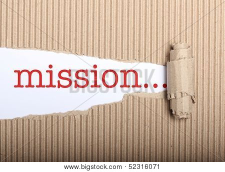 Mission Text On Paper And Torn Cardbox